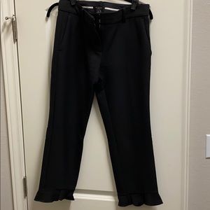 Black Capri slacks with ankle ruffle detail
